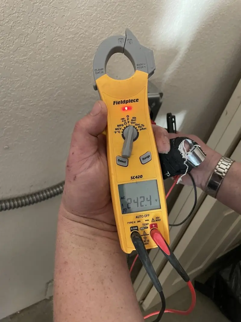 Voltage testing with clamp meter during Outlet Installation in Forest Park